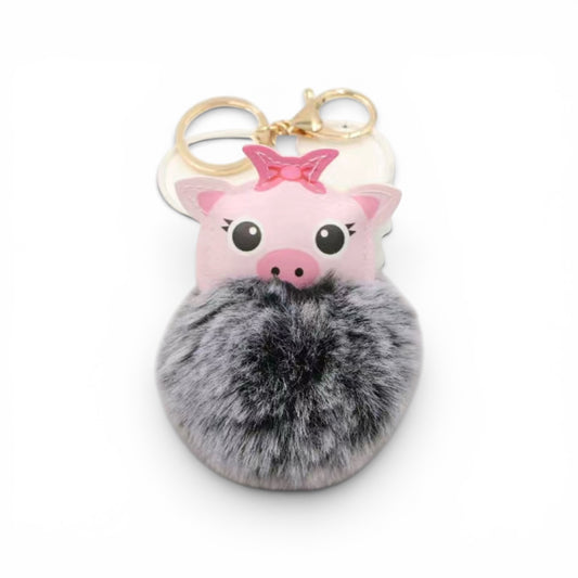 Llavero de cerdito y bolita peluda