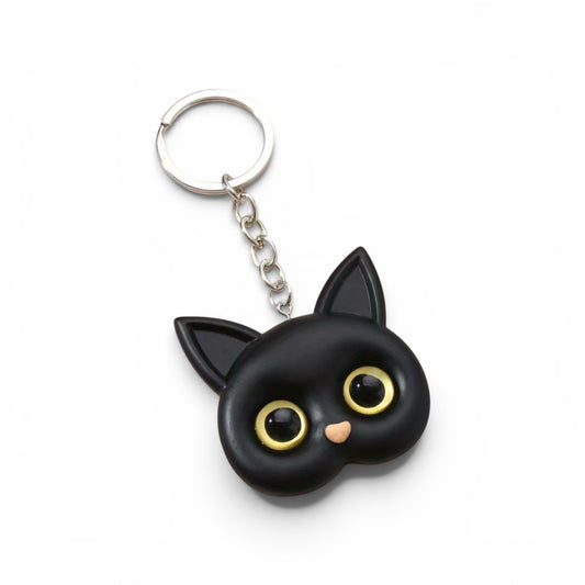 Llavero de gato negro de ojos grandes